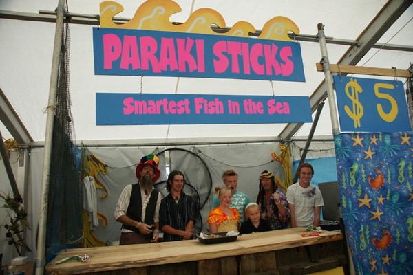 Daniel Dick (left) and Steve Hoy with young family members running their first stall at the Hokitika Wildfoods Festival.