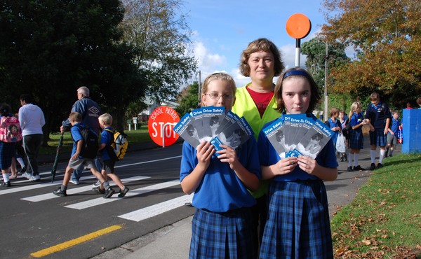 St Mary�s School pupils Mikayla Sundvick and Laura Baillie, supported by Laura�s mum Janet Baillie, a member of St Mary�s School�s volunteer road patrol.