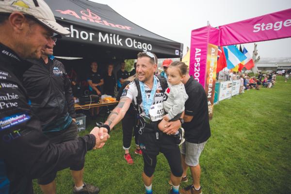 Back Country Cuisine Alps 2 Ocean Race mens unsupported winner Brendon Thompson is greeted at the finish line by Event Course Manager John Crombie 