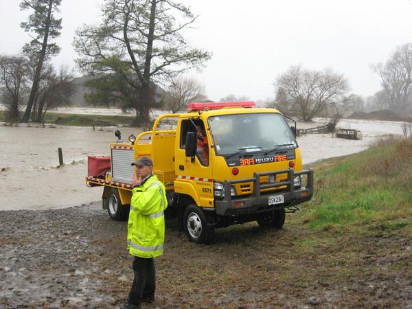 Civil Defence volunteer Gordon Foster looks over flooded farmland near Maraekakaho during the April 2011 floods.