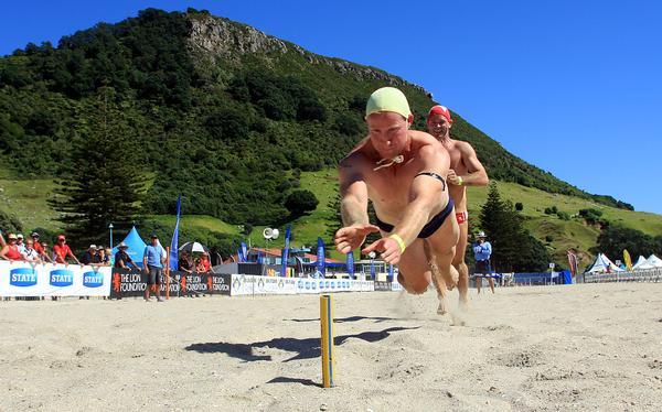 South Brighton's Malcolm MacDonald wins the 30-39 beach flags at the national masters surf lifesaving championships in Mount Maunganui today, as he warms up for the full national championships which start tomorrow.
