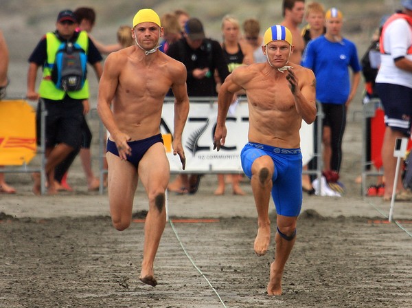South Brighton's Ben Ryan (left) and eventual winner Morgan Foster in the men's beach sprint.