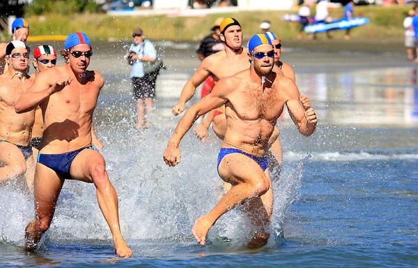  Glenn Anderson (right) heads into the water with Mairangi Bay's Michael Buck at the start of the run-swim-run. 