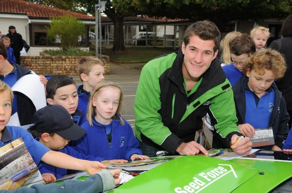 Rally New Zealand's long-running children's colouring competition results in three age group winners and their friends getting a ride to school in a convoy of rally cars. Young Whangarei driver Ben Jagger signs autographs at Remuera Primary School whose F