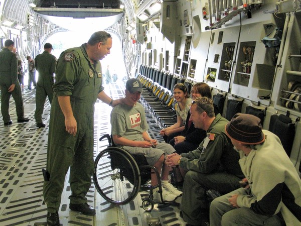 Lt. Col. McGann showing visitors around the C-17