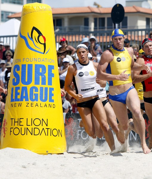 Daniel Moodie (left) follows Glenn Anderson out off the beach in last year's Lion Foundation Surf League Ironman final.