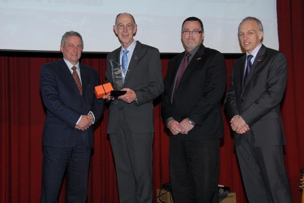 Coastguard Taranaki volunteer Nigel Hayton is presented with the TelstraClear Coastguard Operational Volunteer of the Year Award