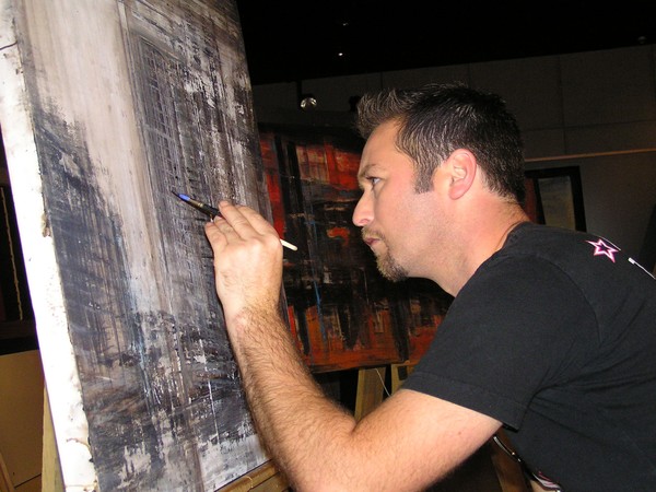 Artist Matt Davison at work on an Auckland City Scape impression
