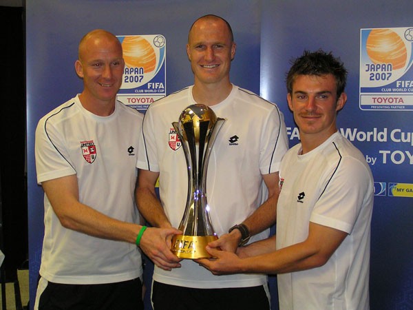Waitakere players holding the FIFA Club World Cup
