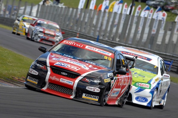 Kayne Scott (car #99) ahead of John McIntyre (car #1) competing at Pukekohe for round two of the BNT V8s Championship.