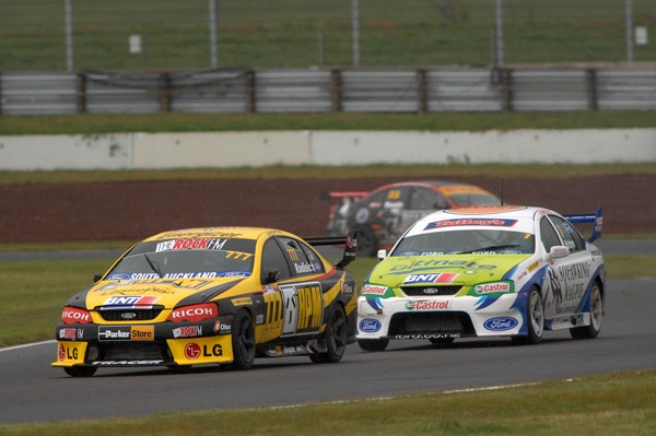 Paul Radisich in the yellow HPM Ford heads for victory in race 2 for the BNT V8s in Taupo with defending champion John McIntyre in hot pursuit.