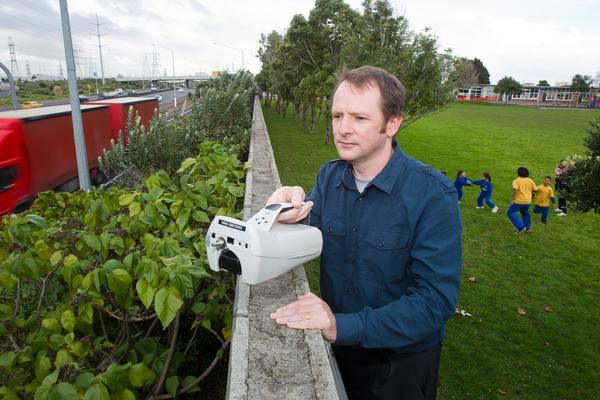 Dr Ian Longley records air samples