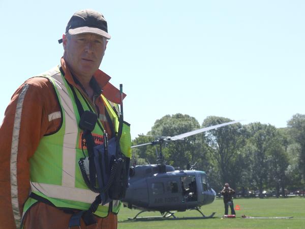 Department of Conservation's Shane Cross is the Hagley Park "lollipop man", co-ordinating helicopter movements in and out the central city emergency response air base.  