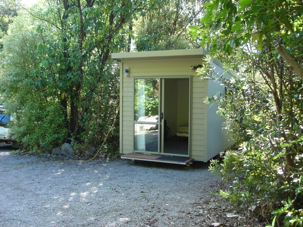 The trailer-mounted one room cabins can serve as bedrooms, home offices or simply spare living space