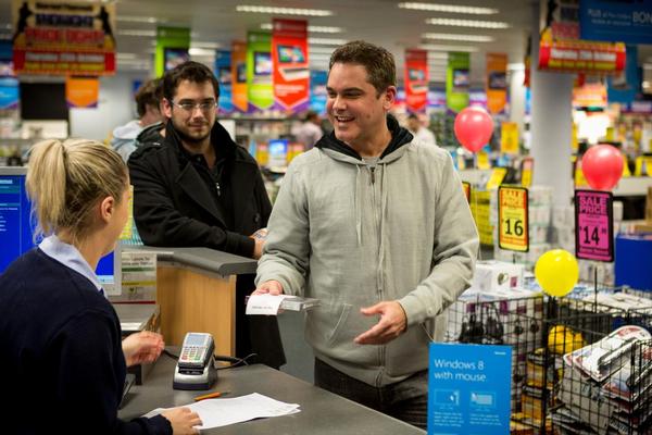 The world's first copy of Windows 8 being sold to Greg Daniel
