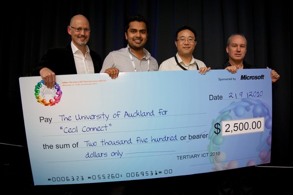  The University of Auckland CECIL Connect team with their cheque, flanked on the left by Microsoft's Tertiary Sector Manager, Evan Blackman, and on the right by Miles Fordyce, Chair of the Tertiary ICT Conference Committee.