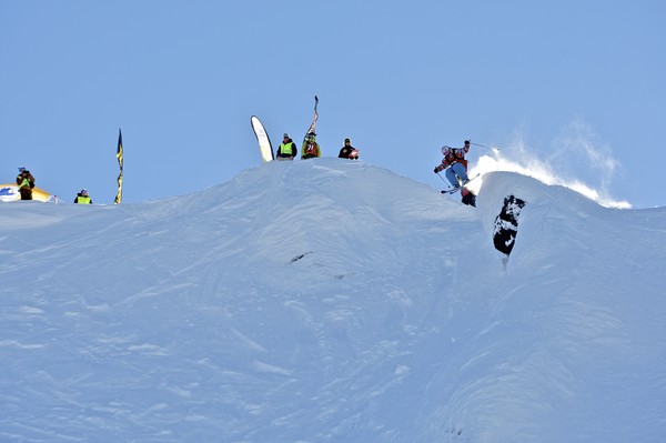 Chris Booth launches off the start of the Big Mountain Day of the World Heli Challenge