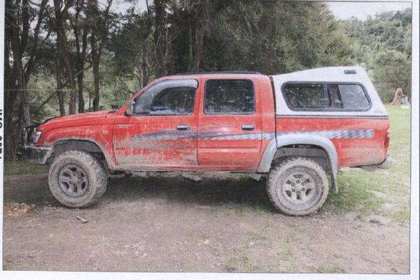 Mr Hall's Toyota Hilux is next to his insecure caravan