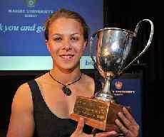 Lisa Carrington with the cup for Albany sportswoman of the year.