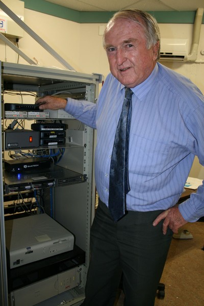 Jim Price checking Environment Waikato telemetry equipment