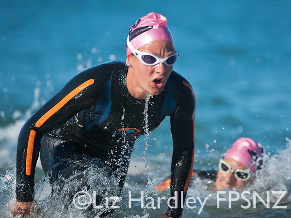 Race winner Penny Hayes leading Rebecca Clarke at the swim exit.