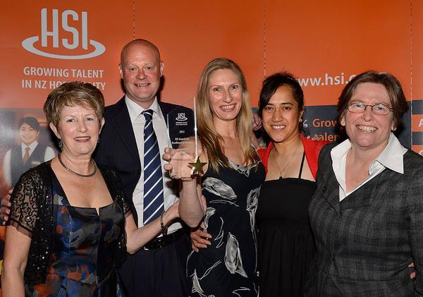 Excellence in Training Supreme Award winners McDonald's (NZ) Limited accept their award from HSI Chair Carol Stigley at the HSI national training awards event at Auckland's Langham Hotel October 28 2012