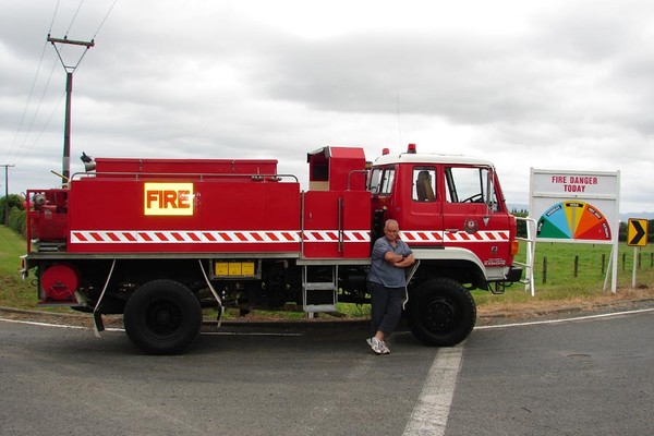 Principal Rural Fire Officer Lance Johnston with the imported replacement appliance for the Kaitaia Rural Fire Party, alongside one of the seven new fire risk warning signs erected across the Far North this summer. 