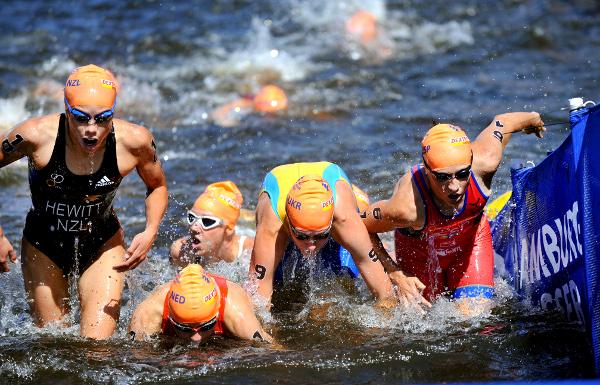 Andrea Hewitt (left) exits the swim on the first leg of the relay.