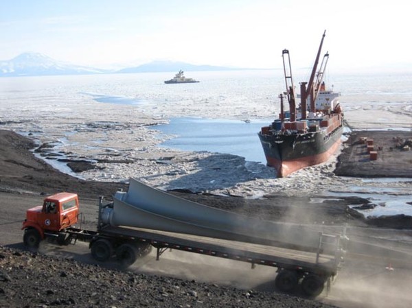Wind turbine blades transported by truck from McMurdo Station ice pier