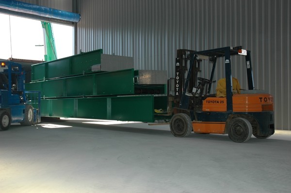 First shipment of the automated sorting plant being unloaded into the newly built Wakatipu Recycling Centre. 