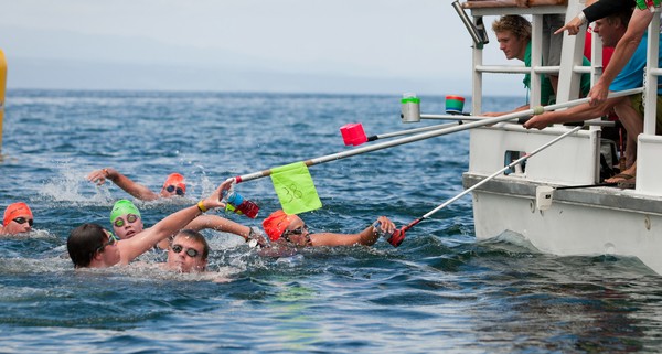 Philip Ryan leading as swimmers complete their food stop in the State Insurance national 10km open water swimming championships on lake Taupo today