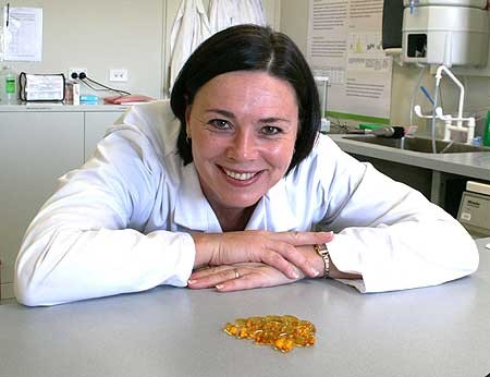 Associate Professor Welma Stonehouse, from the Institute of Food, Nutrition and Human Health, with capsules containing omega-3 fish oil.