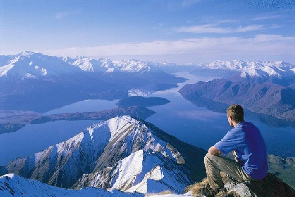 A hiker taking in the spectacular view over Lake Wanaka