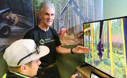 Swedish forestry tutor Anders &#214;berg shows student Bradley Solomon, 18, new functions on one of Toi Ohomai's harvesting simulators. Bradley is taking a three-month course in Basic Machine Operation before returning to his harvesting crew in Gisborne.