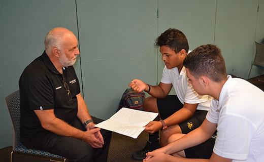 Toi Ohomai Youth and Community Engagement Leader for EBOP and Regional YES Coordinator Greg Brimmer works with Whakatane High School students on their business idea.