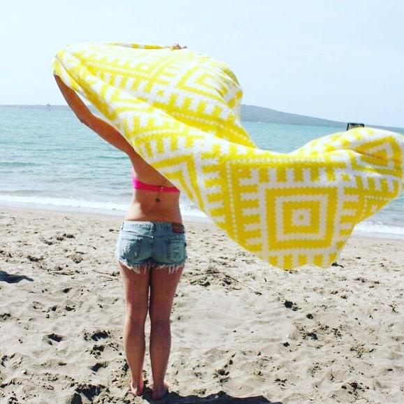 Towels from New Zealand-based Towelling It are the perfect beach companion for your next holiday.