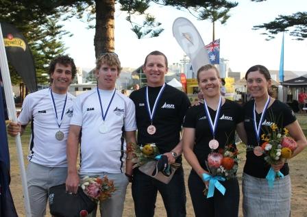 Blair Tuke, Peter Burling, Andrew Murdoch, Olivia Powrie and Jo Aleh proudly display their 2011 World Championship medals