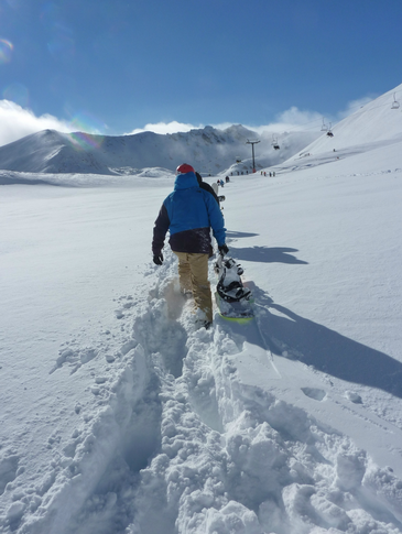 Hiking in knee deep powder at The Remarkables. 