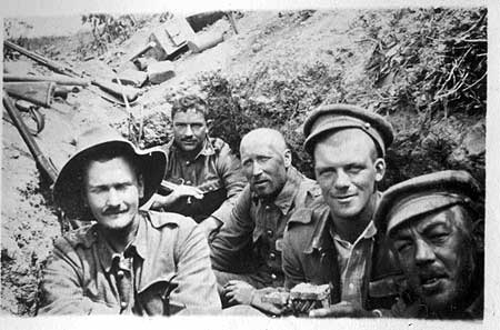 The strain shows clearly on the faces of these New Zealanders in the trenches at Gallipoli despite their attempts to smile. Their names are given as Hall-Jones, G Brown, Fisher and Olsen although in which order is not clear.