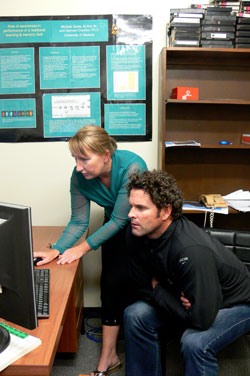 Off the Rails: Masters student Helen Clark gives cricketer and rail safety campaigner Chris Cairns a demonstration of her computer simulated experiment during his visit to discuss her research.