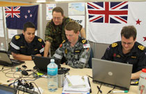 Defence Force personnel involved with the Rena recovery and cleanup pictured in the Incident Control Centre in Tauranga.
