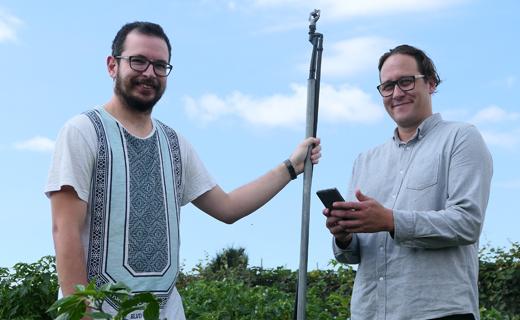 Jacob Van Silfhout (right), with Sam Gough, about to activate the sprinkler system at Toi Ohomai's Windermere horticulture department, via his mobile phone.
