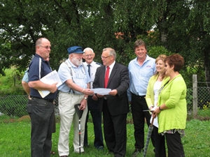 Mayor Alistair Sowman gets a look at the Shed plans with the members of the group supporting the project.