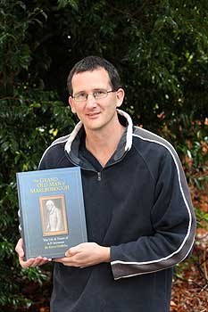 Massey technician Kerry Griffiths with his historical  book based around 19th century Picton politician  Arthur Seymour.