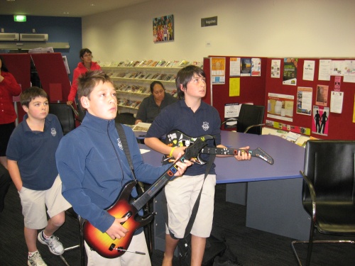 Youth �having a go� at the Guitar Hero III practise sessions at Taupo Library