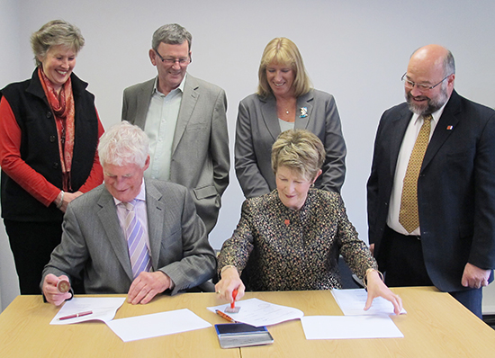 The Deed of Merger signing: seated from left, Philip Shewell, Retail Institute Chairman and Carol Stigley, HSI Chair with (standing from left) Jill Hatchwell, ATTTO Board Director, John Albertson, Retail Institute Board Director, Kathy Wolfe, CEO of ATTTO, and Bruce Robertson, HSI Deputy Chair. 