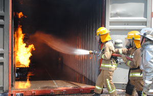 Sam Webb gets to grips with fighting fire during STWC training at Bay of Plenty Polytechnic 