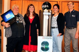 Emily Glew (left) and Fiona Taylor (second from right) both of Opononi receive their prizes from Far North Deputy Mayor Ann Court and Council refuse engineer Bruce Hows.