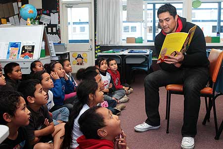 Vodafone Warriors player Jerome Ropati taking part in the One Community reading programme.