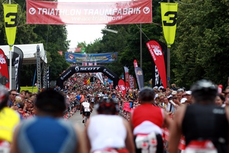Cyclists take on the legendary Solarar Berg, lined with over 35,000 spectators at Challenge Roth 2012
